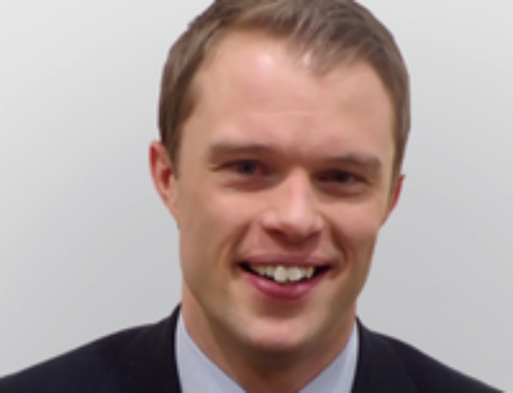 Head and shoulders shot of Dr Iain Cameron against a white background.