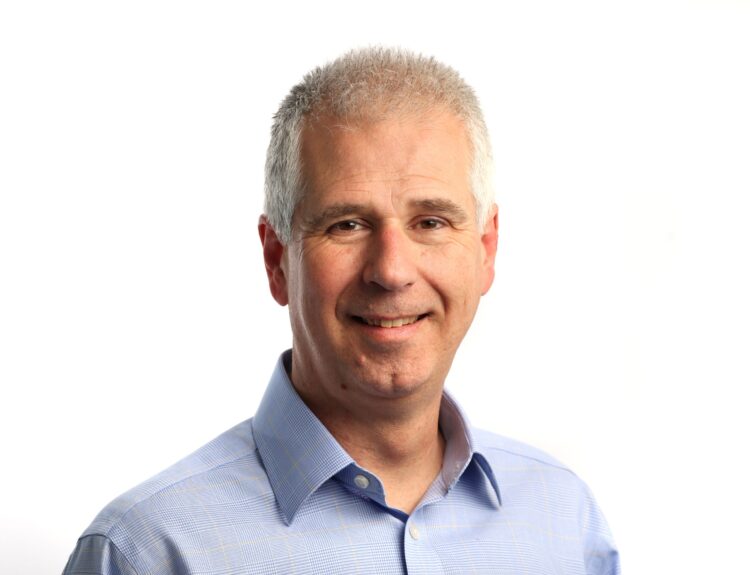 Headshot of Neil Halford against white background.